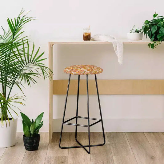 Taburete tapizado con estampado floral